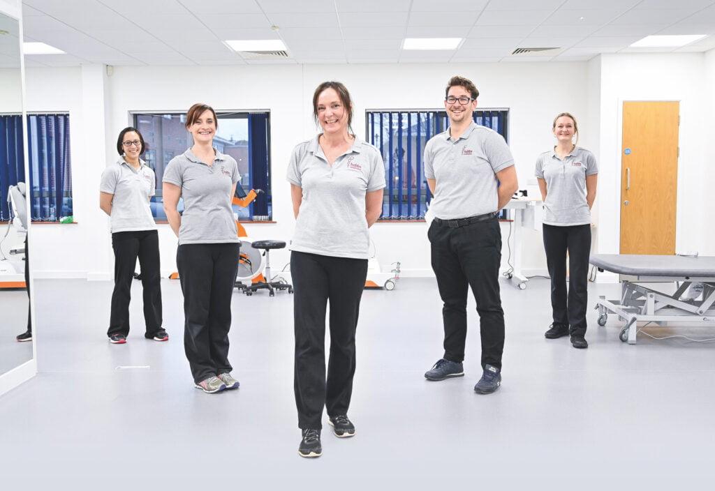 Helen Hobbs, co-founder of Hobbs Rehabilitation, pictured in triangle formation with 4 other members of the team