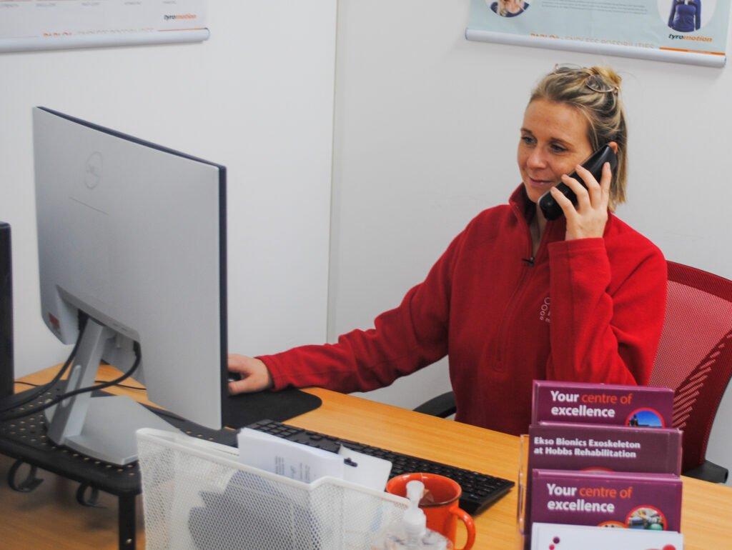 Therapist taking a telephone screening for Hobbs Rehabilitation