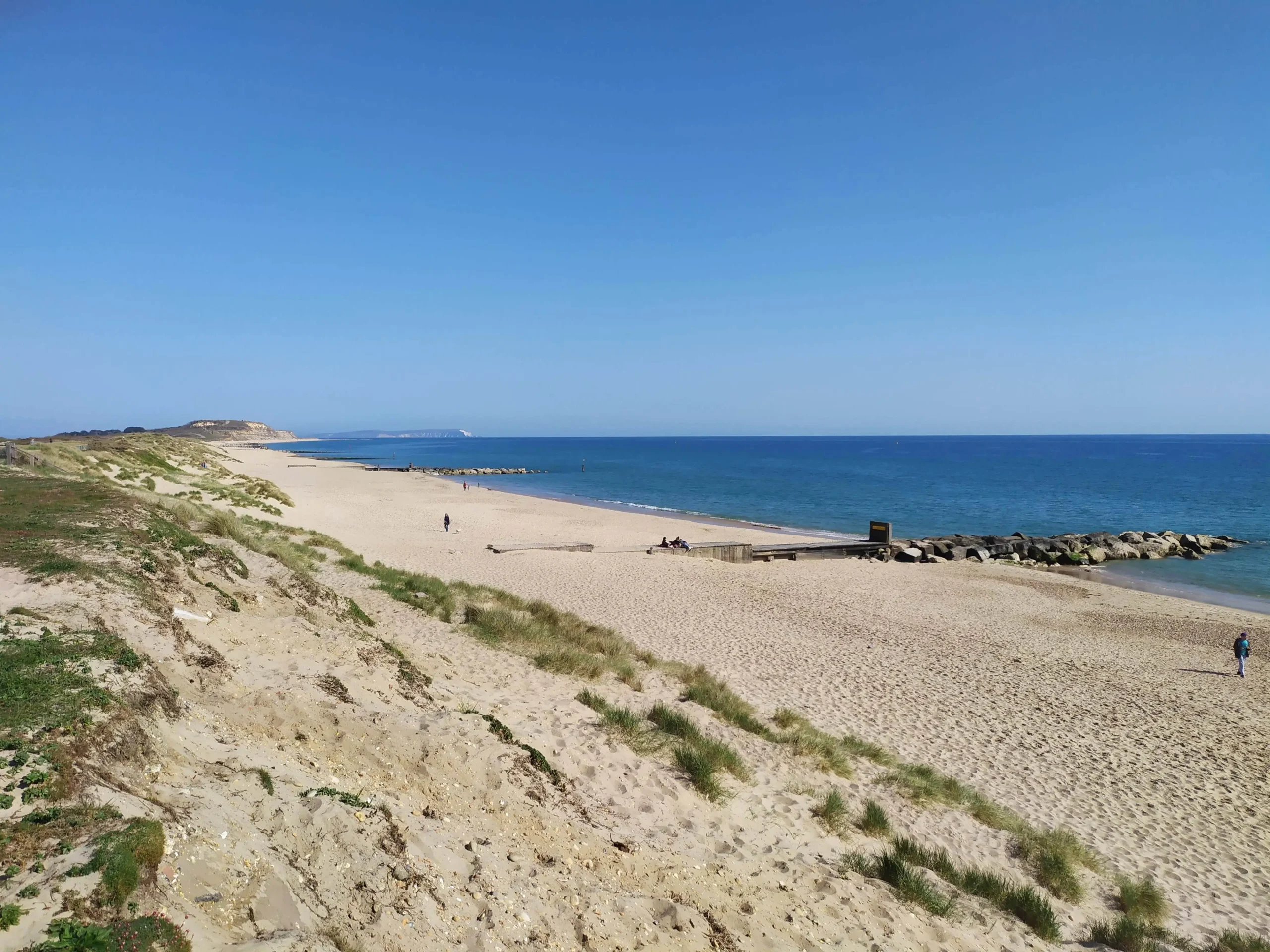 Landscape of Dorset beach on a bright blue day