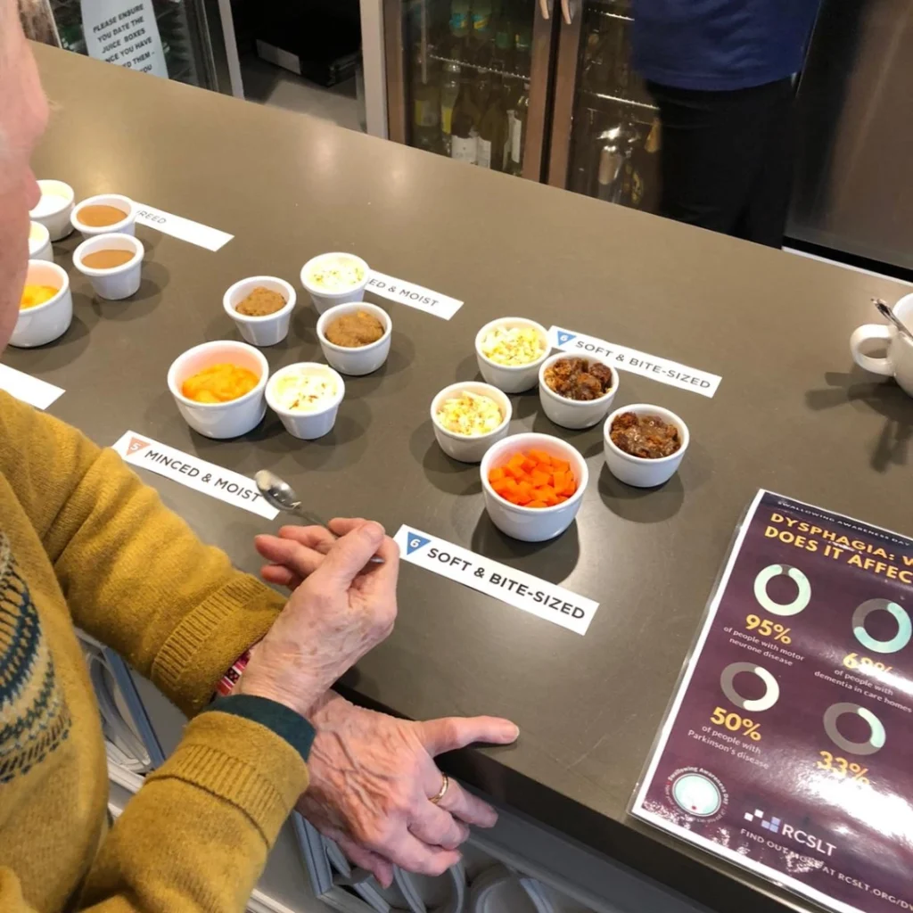 Little tasters on the table with a Gent sampling the variety of foods for Swallowing Awareness Day